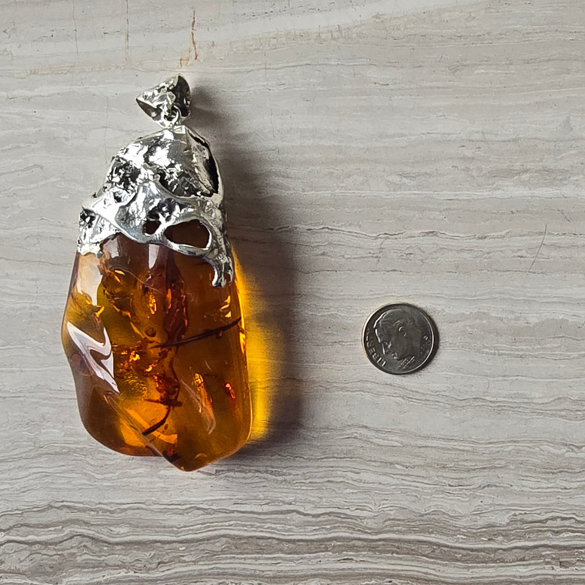 Baltic Amber Pendant set in hand formed silver bail, large statement sized polished raw Baltic Amber necklace.