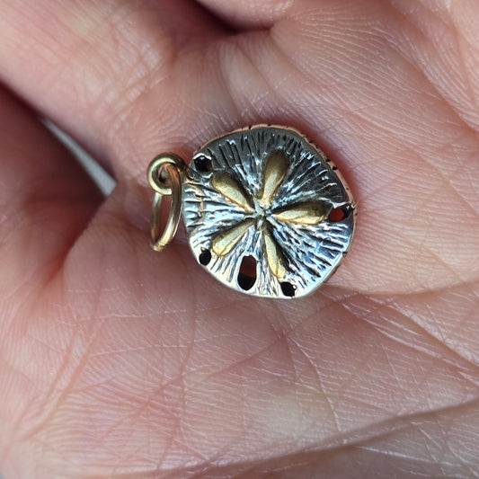 silver and gold sand dollar charm