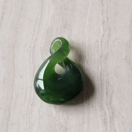 Jade infinity charm