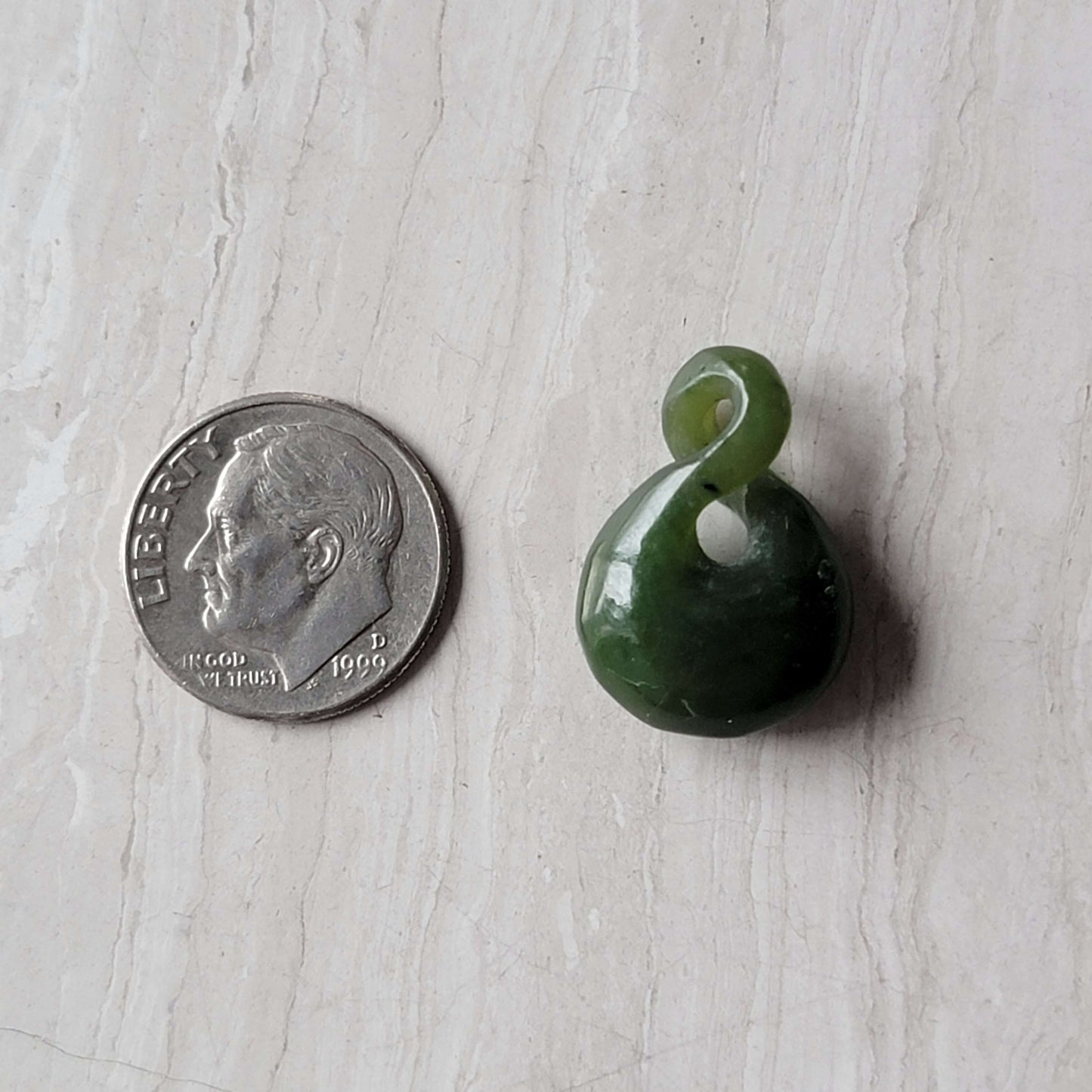 Jade infinity charm