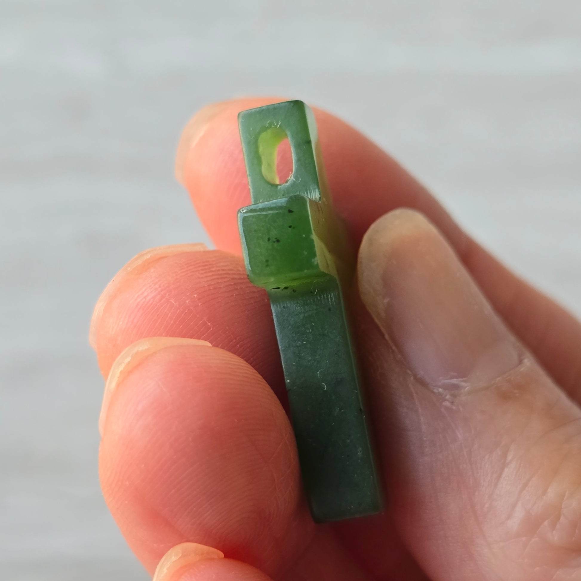 jade cross with a side drill hole