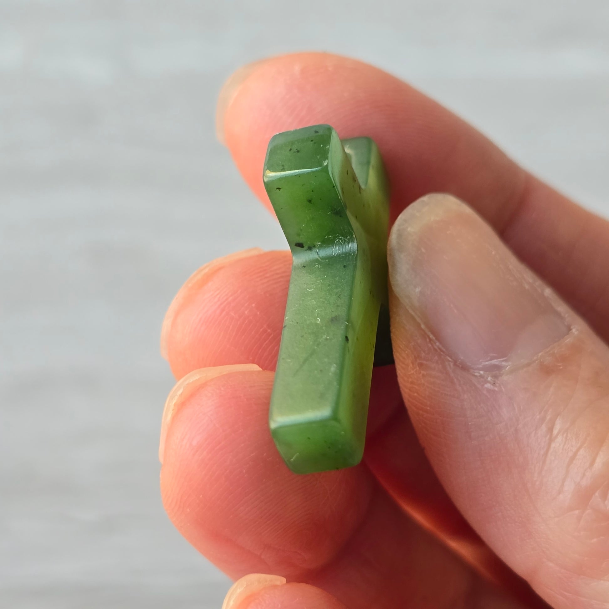 jade cross with a side drill hole