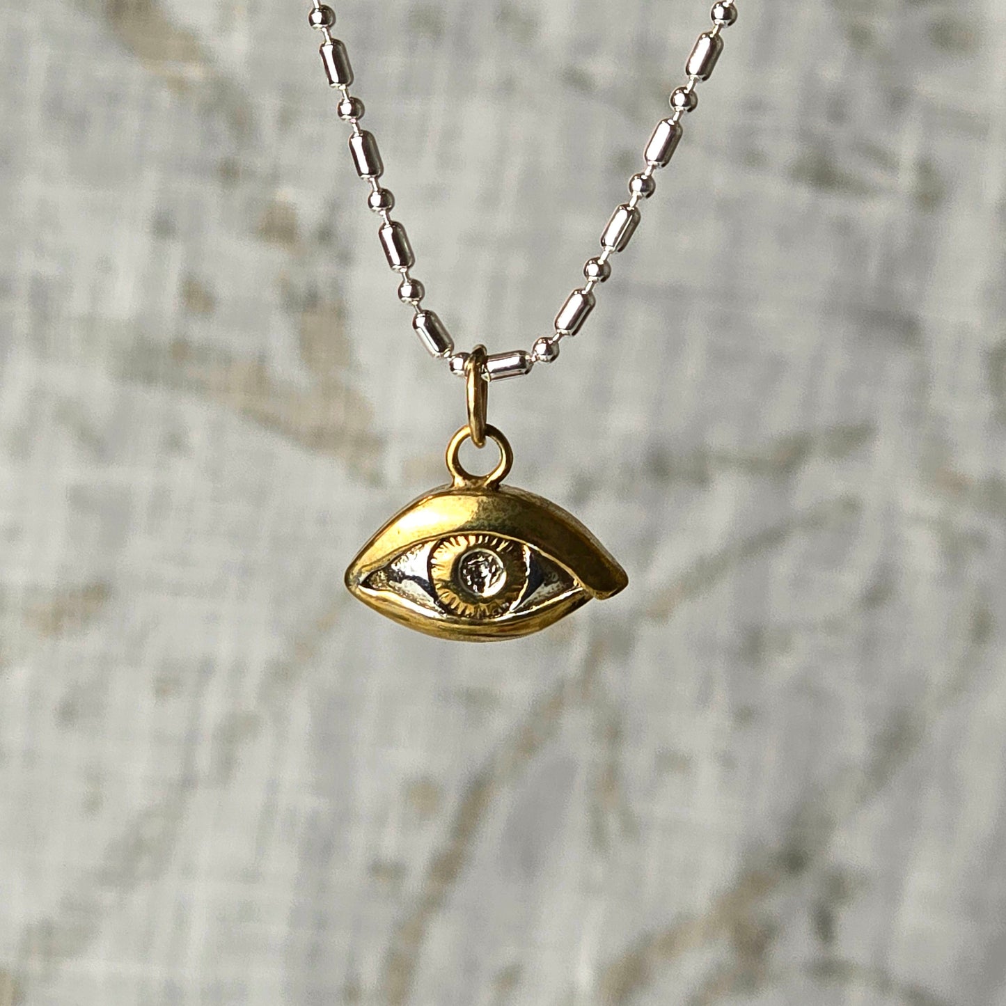 Silver and Gold evil Eye charm