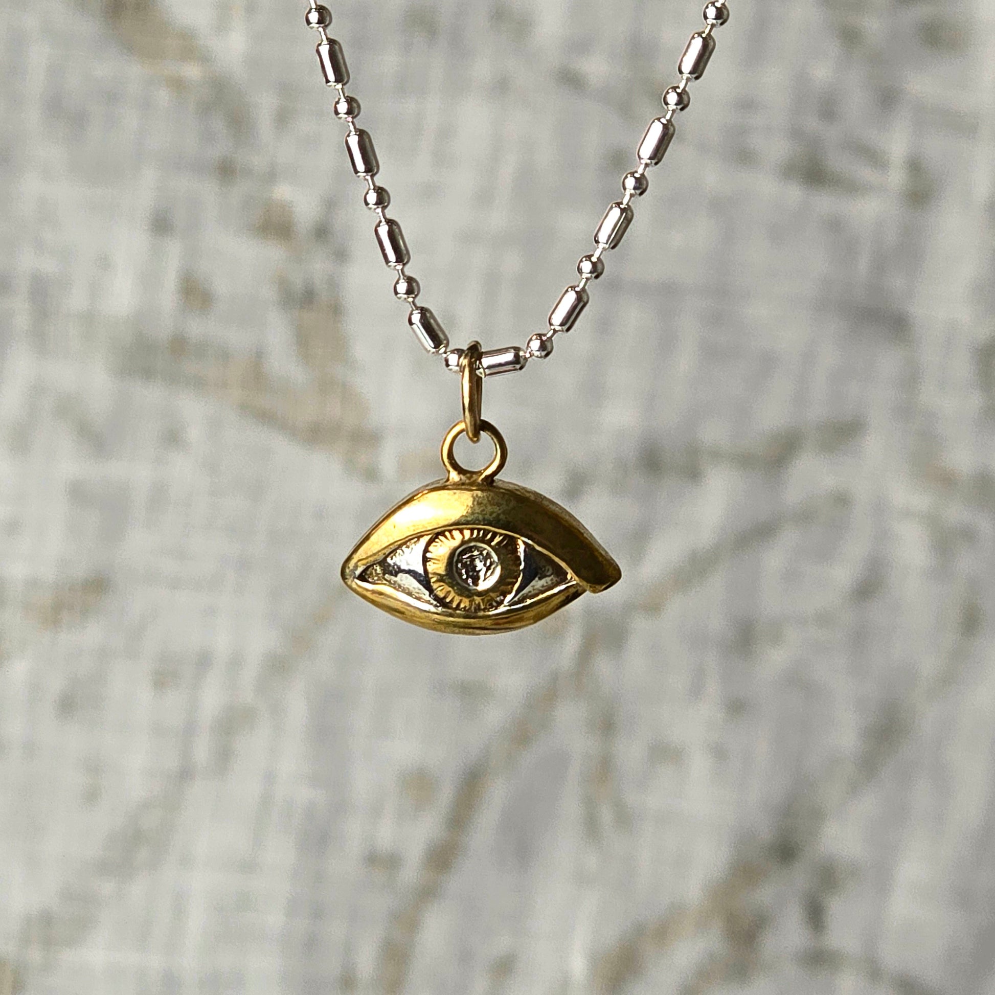 Silver and Gold evil Eye charm