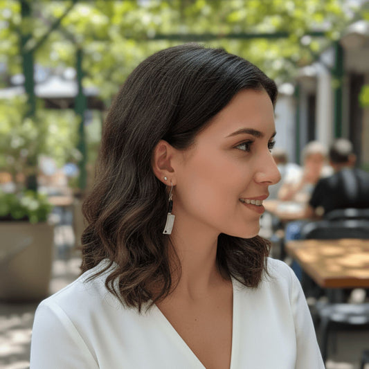 woman wearing edgy silver cleaver earrings