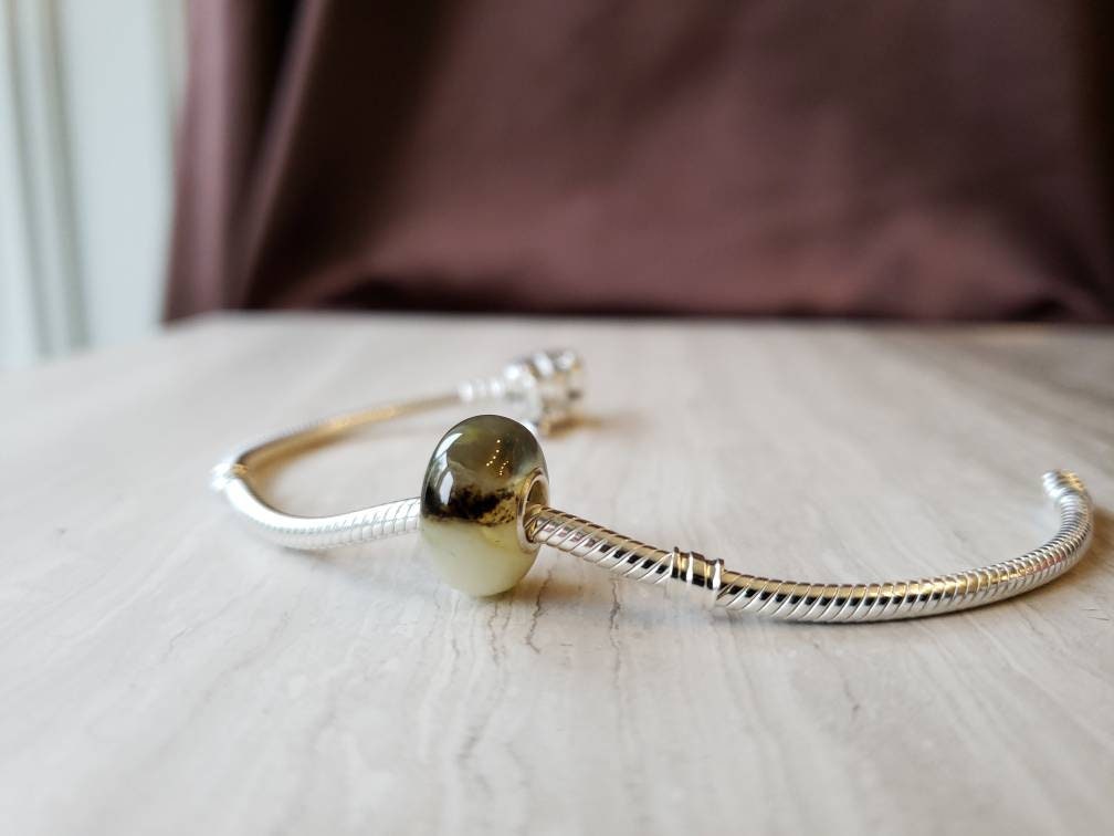 cream and white baltic amber bead with silver core for Pandora bracletscream and white baltic amber bead with silver core for Pandora braclets