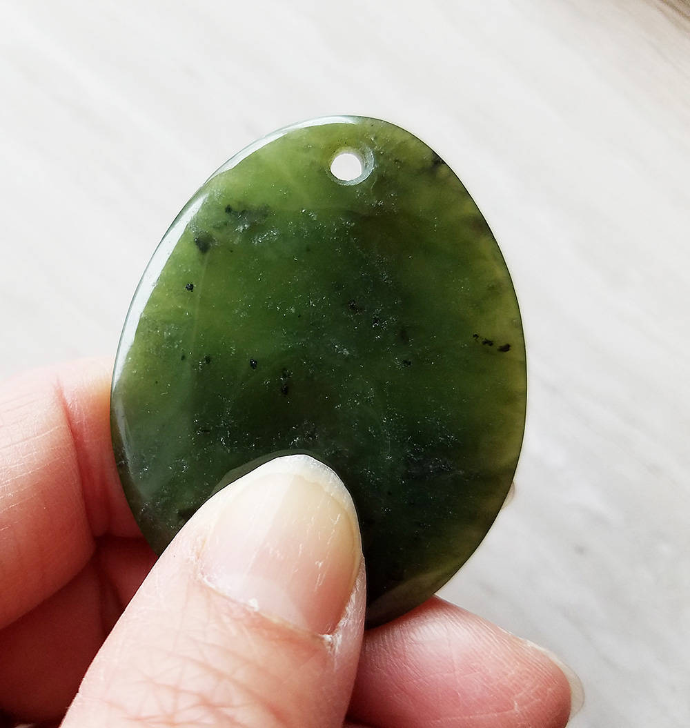 large jade worry stone pendant