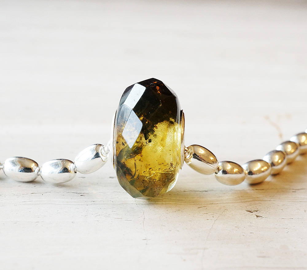 Black and white baltic amber bead polished facets