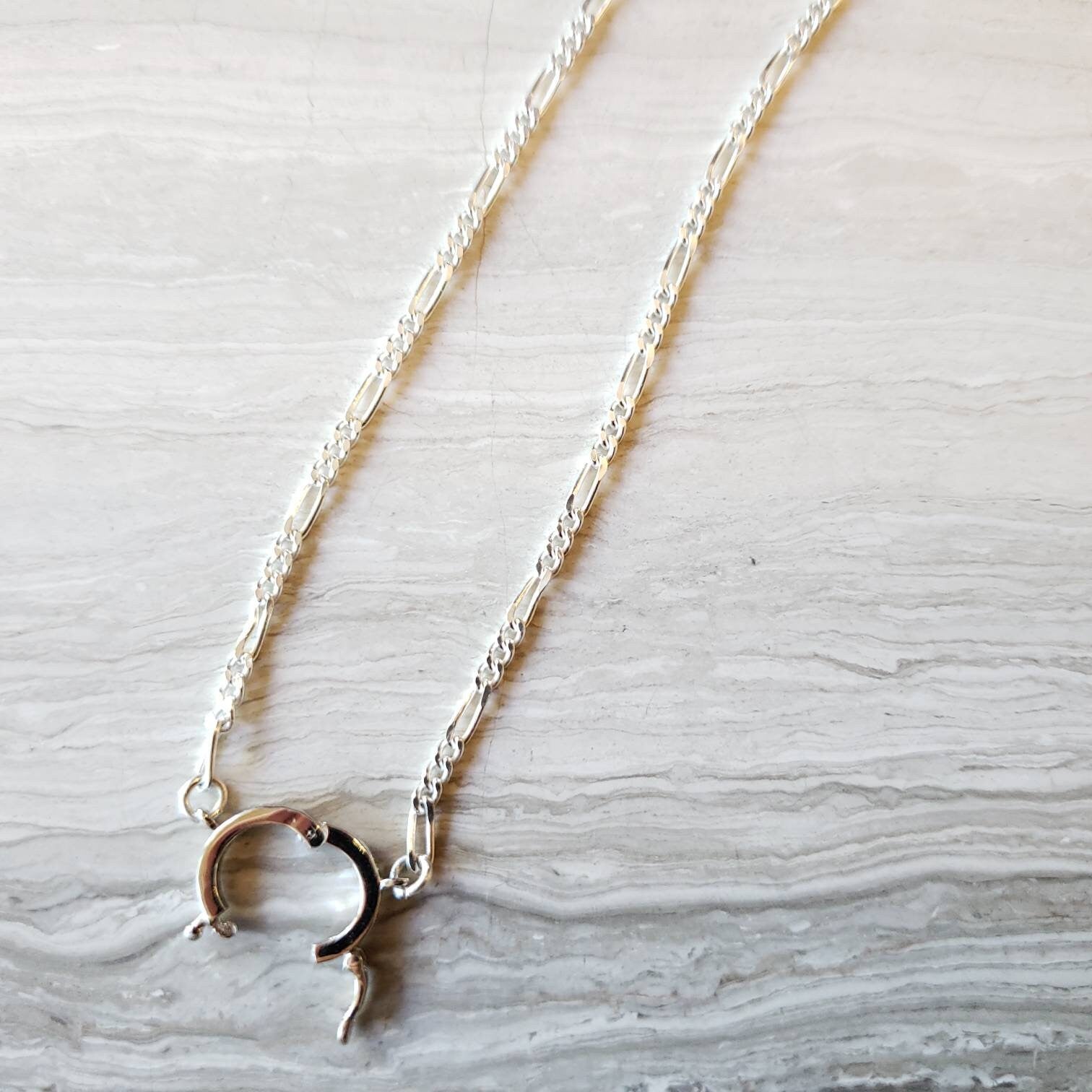 Silver figaro chain with custom bail