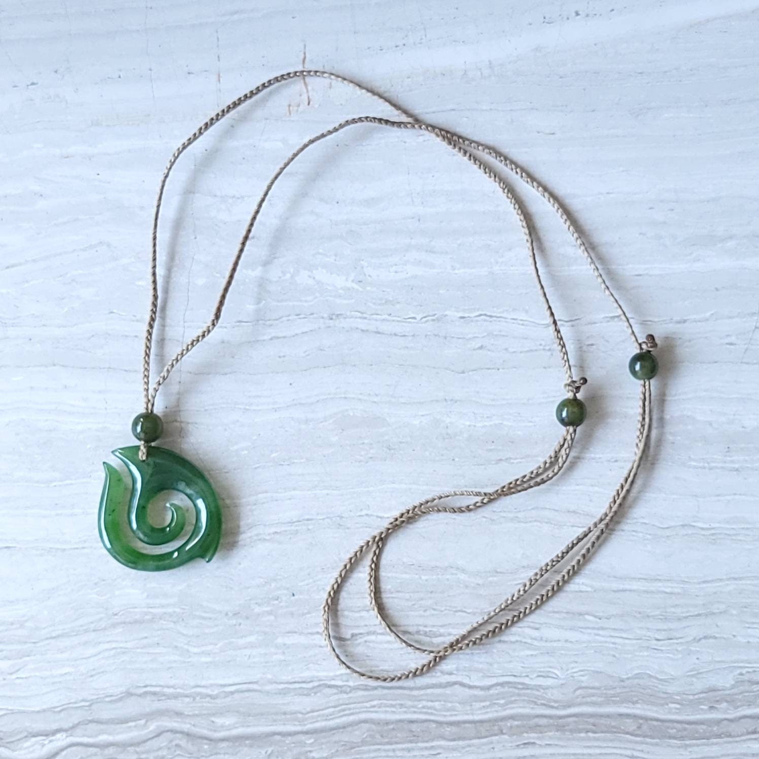 jade maori fish hook necklace