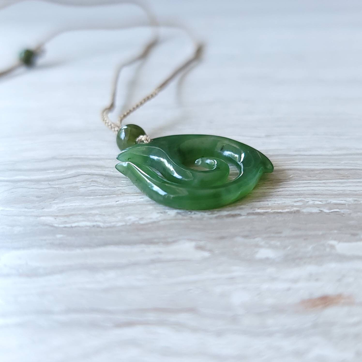 jade maori fish hook necklace
