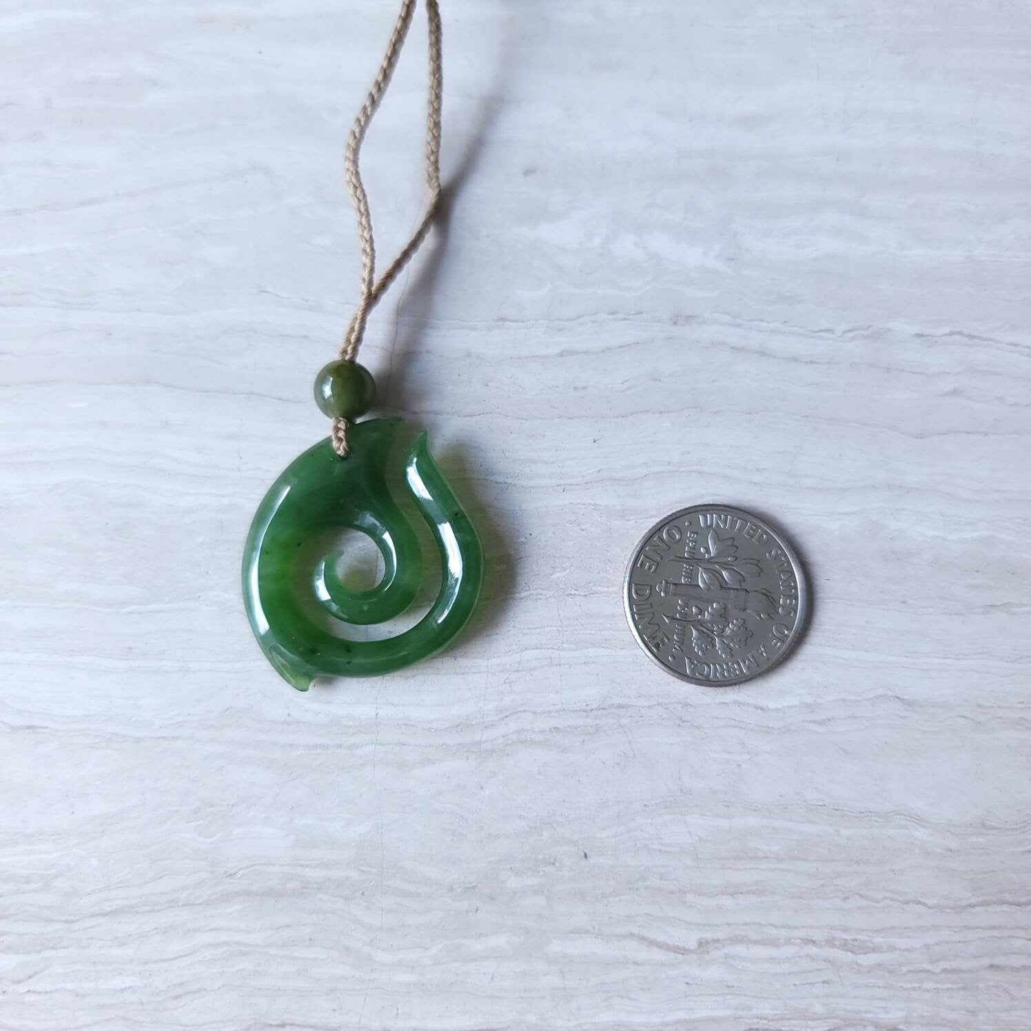 jade maori fish hook necklace