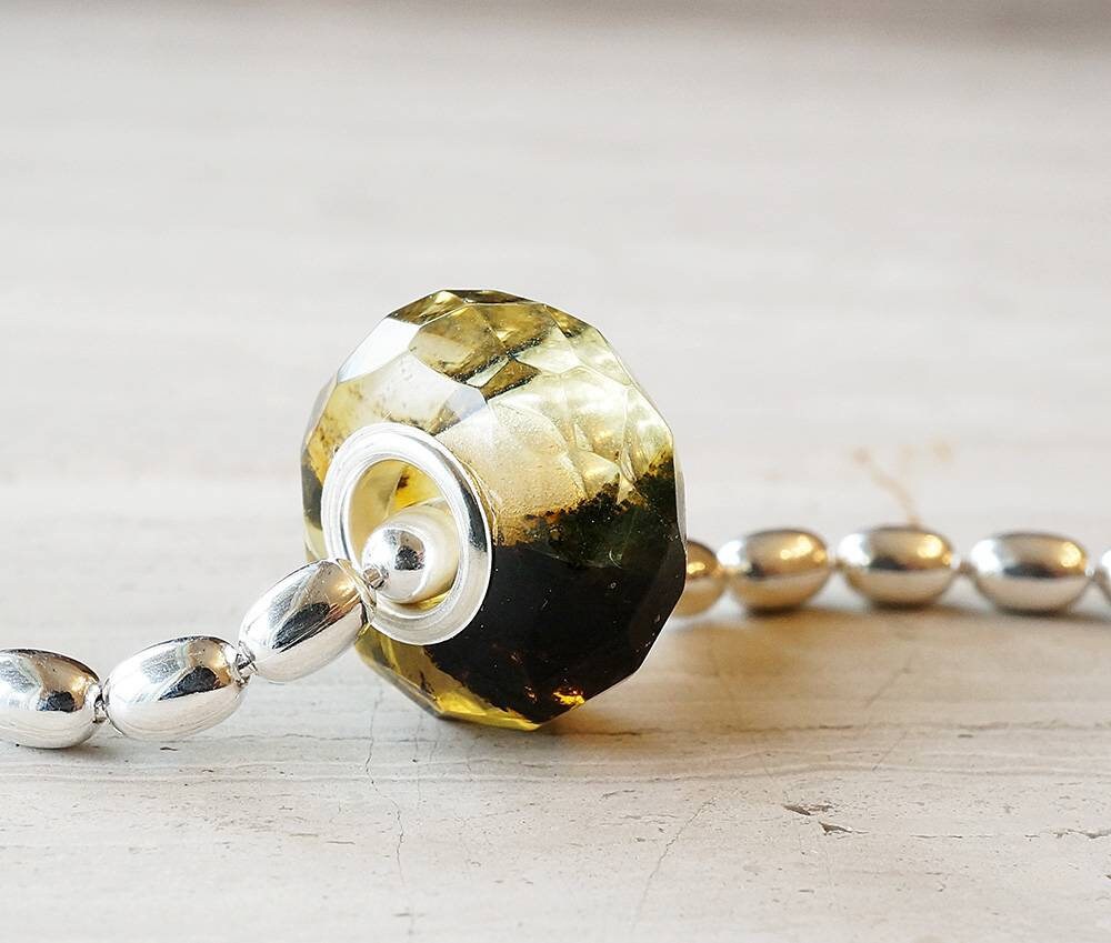 sterling silver heavy rice bead chain with a marble amber bead