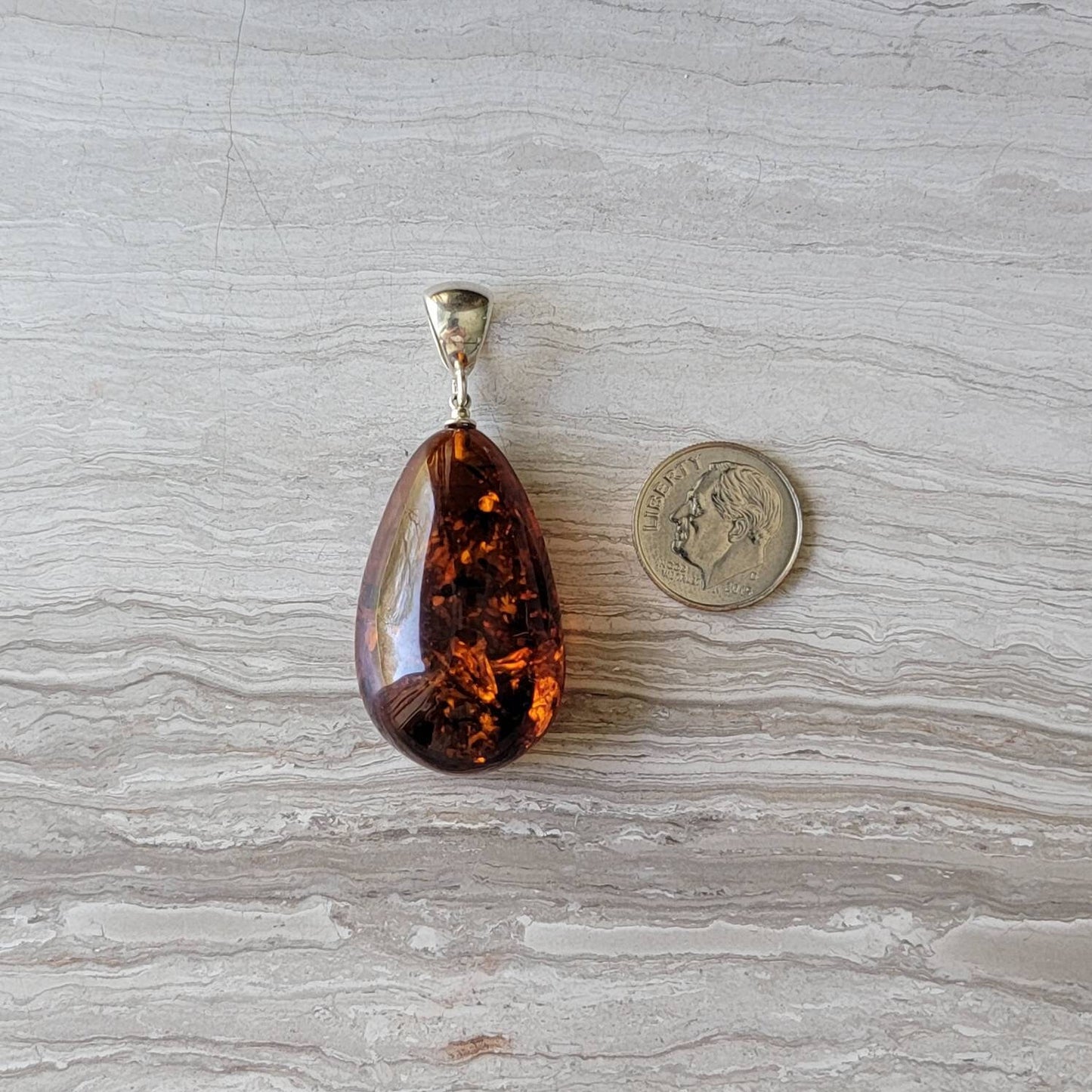 baltic amber teardrop pendant with sterling silver bail