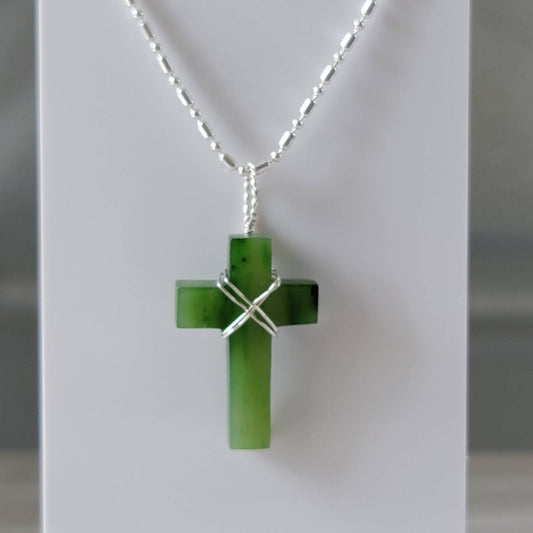 jade cross with silver criss cross bail