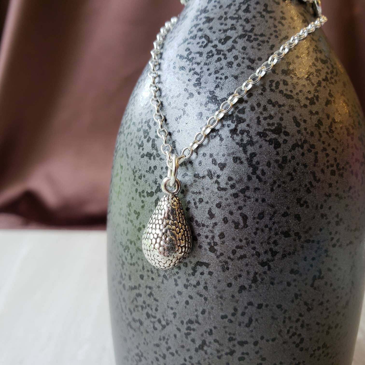 silver and gold avocado charm pendant