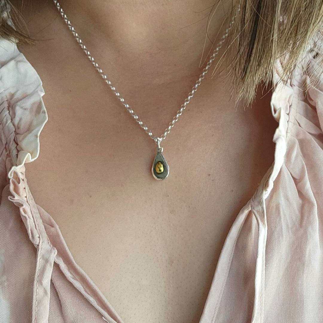 silver and gold avocado charm pendant