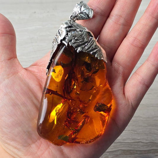 Baltic Amber Pendant set in hand formed silver bail, large statement sized polished raw Baltic Amber necklace.