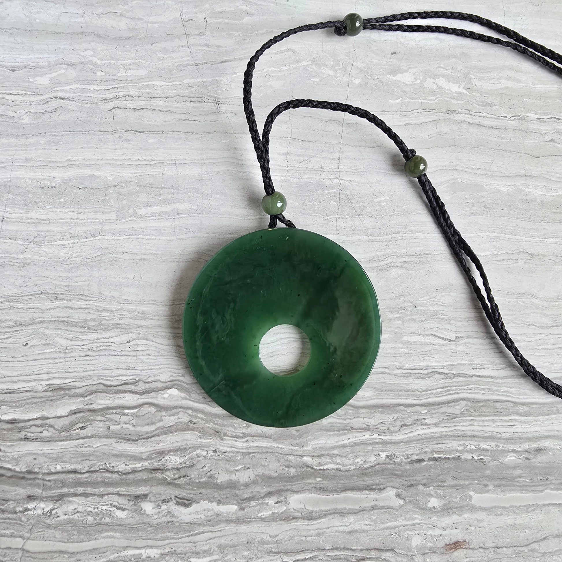 Siberian jade round disk necklace with an adjustable cord necklace