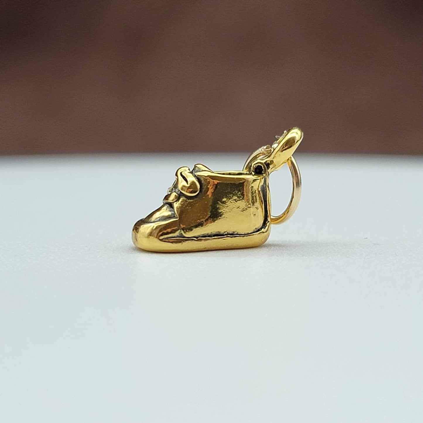 gold baby shoe charm pendant