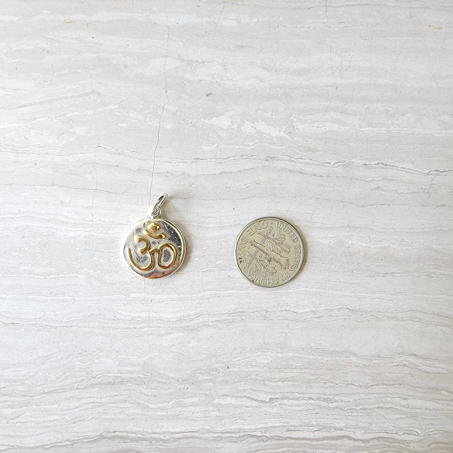 Om silver charm with 24k gold plate