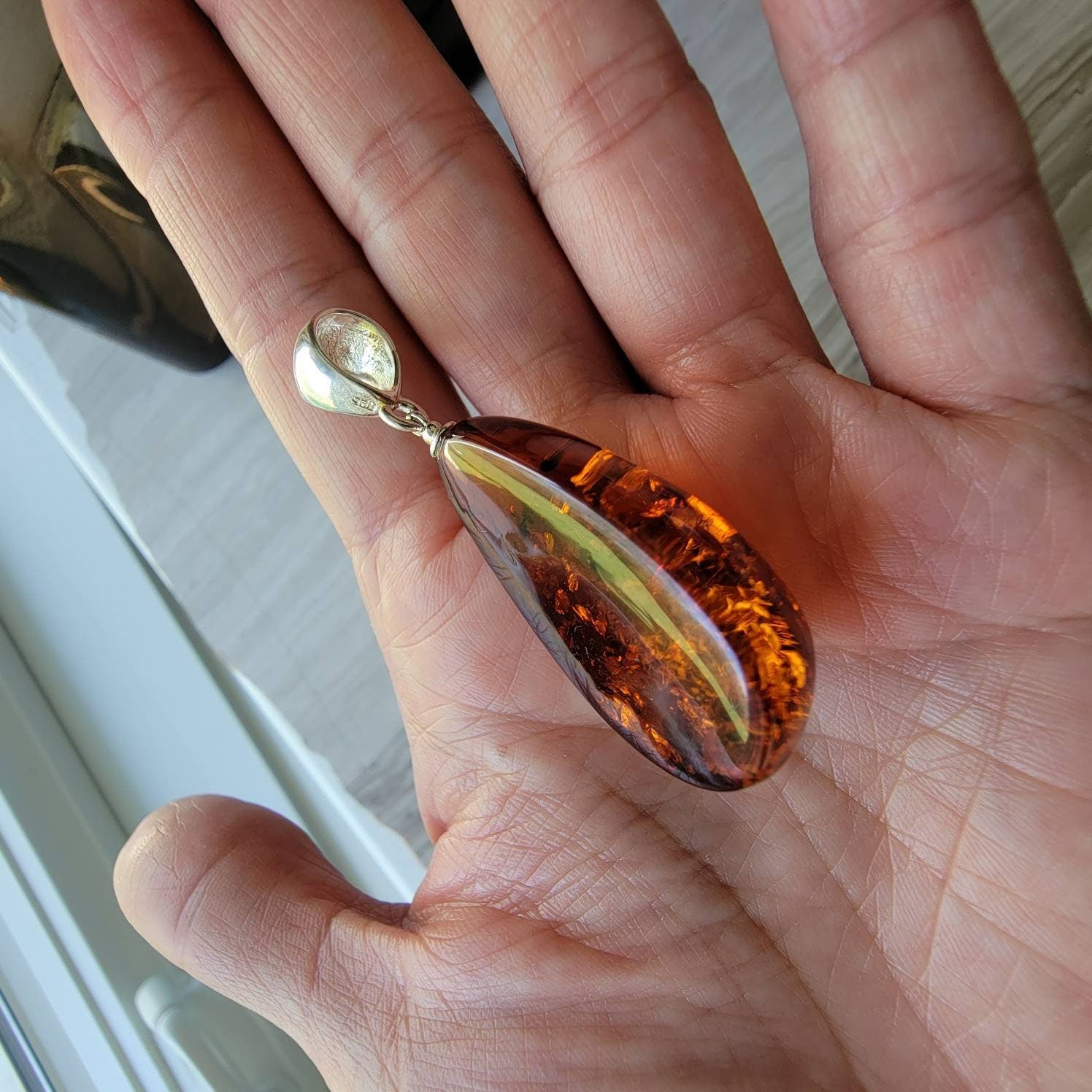 baltic amber teardrop pendant with sterling silver bail